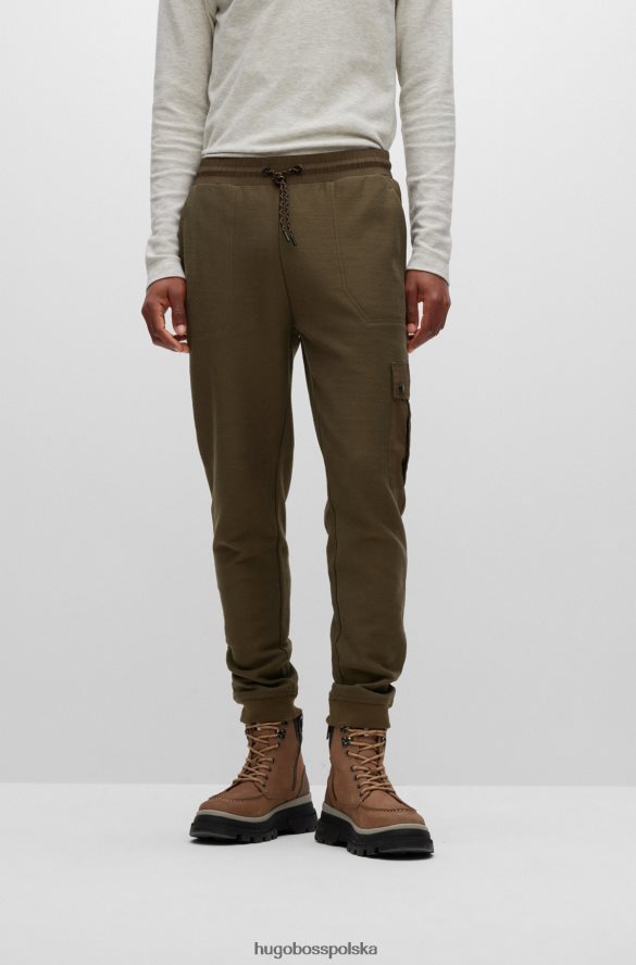 Hugo Boss Spodnie dresowe z bawełny frotte z naszywką z logo Hugo w kolorze ciemnozielonym ciemnozielony R0X0H64397