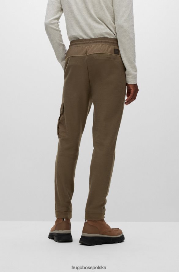 Hugo Boss Spodnie dresowe z bawełny frotte z naszywką z logo Hugo w kolorze ciemnozielonym ciemnozielony R0X0H64397