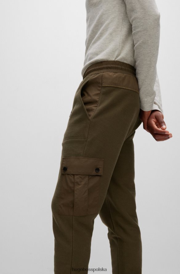 Hugo Boss Spodnie dresowe z bawełny frotte z naszywką z logo Hugo w kolorze ciemnozielonym ciemnozielony R0X0H64397