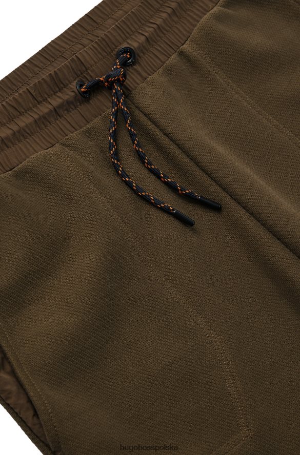 Hugo Boss Spodnie dresowe z bawełny frotte z naszywką z logo Hugo w kolorze ciemnozielonym ciemnozielony R0X0H64397