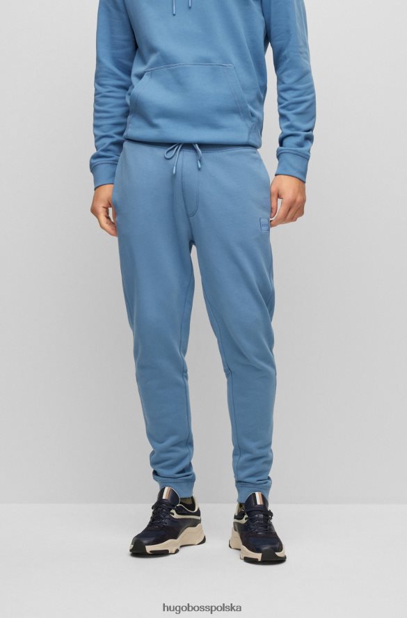 Hugo Boss Spodnie dresowe z bawełny frotte z naszywką z logo Hugo w kolorze jasnoniebieskim jasny niebieski R0X0H61435