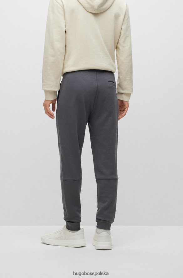 Hugo Boss Spodnie dresowe z bawełny frotte z naszywką z logo w kolorze ciemnoszarym hugo ciemno szary R0X0H61439