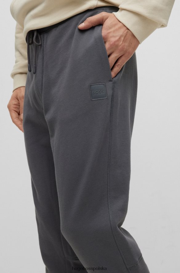Hugo Boss Spodnie dresowe z bawełny frotte z naszywką z logo w kolorze ciemnoszarym hugo ciemno szary R0X0H61439