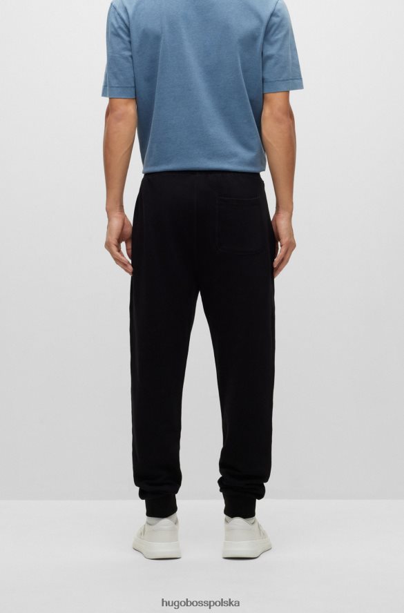 Hugo Boss Spodnie dresowe z bawełny frotte z polarowym logo hugo w kolorze czarnym czarny R0X0H63468