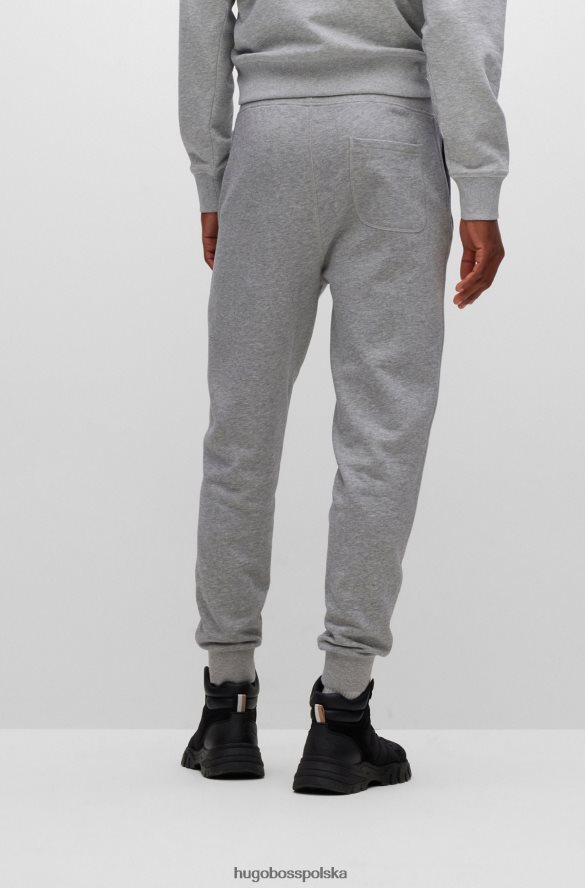Hugo Boss Spodnie dresowe z jasnoszarej bawełny frotte z polarowym logo hugo jasnoszary R0X0H63469