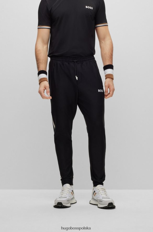 Hugo Boss Spodnie dresowe z logo Hugo x Matteo Berrettini, z charakterystycznymi paskami i mankietami u dołu czarny R0X0H64410