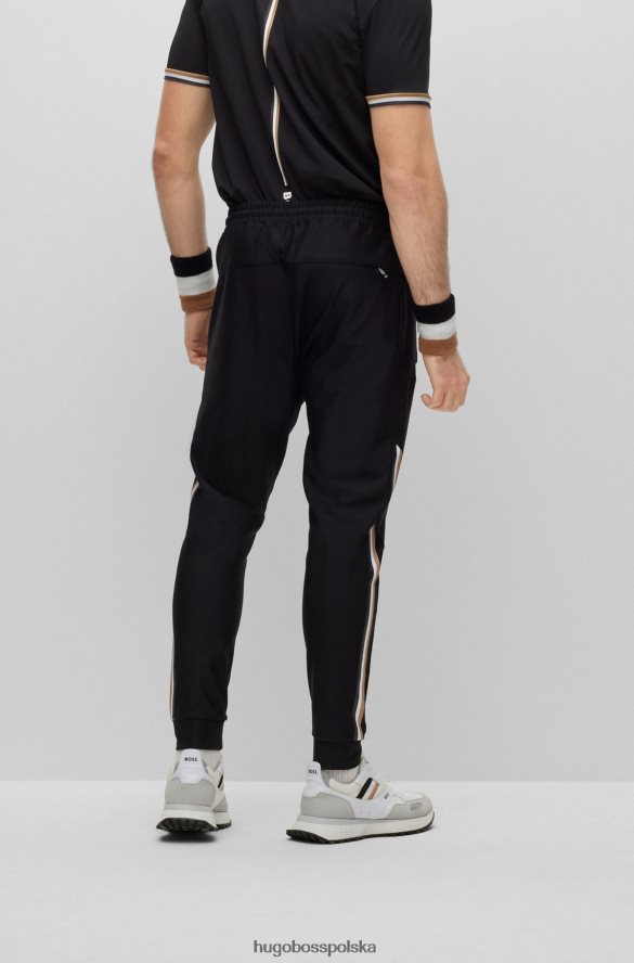 Hugo Boss Spodnie dresowe z logo Hugo x Matteo Berrettini, z charakterystycznymi paskami i mankietami u dołu czarny R0X0H64410