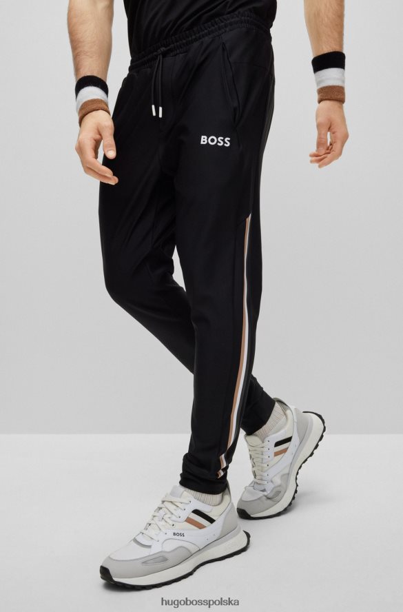 Hugo Boss Spodnie dresowe z logo Hugo x Matteo Berrettini, z charakterystycznymi paskami i mankietami u dołu czarny R0X0H64410