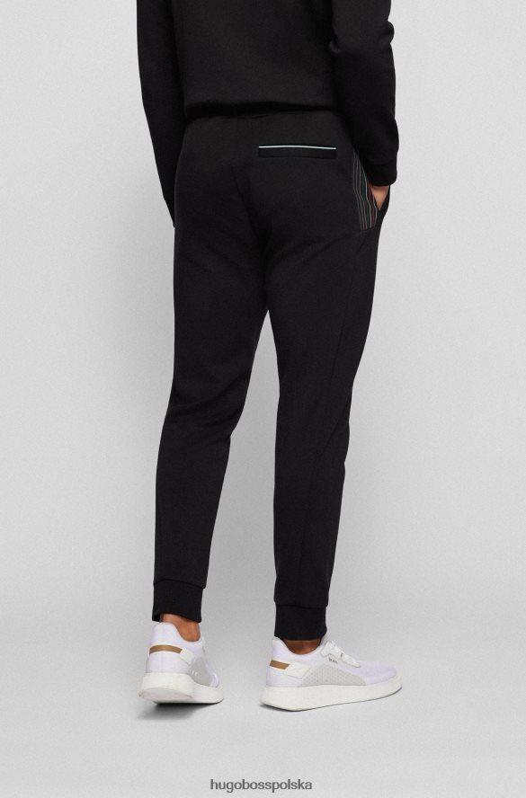 Hugo Boss Spodnie dresowe z mieszanki bawełny z detalami w kolorowe paski, czarne hugo czarny R0X0H61734