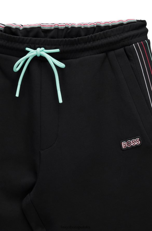 Hugo Boss Spodnie dresowe z mieszanki bawełny z detalami w kolorowe paski, czarne hugo czarny R0X0H61734