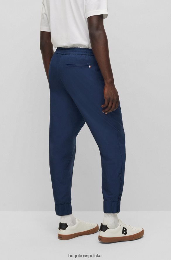 Hugo Boss Spodnie dresowe z mieszanki bawełny, z zapinanymi nogawkami, hugo ciemnoniebieskie ciemny niebieski R0X0H63401