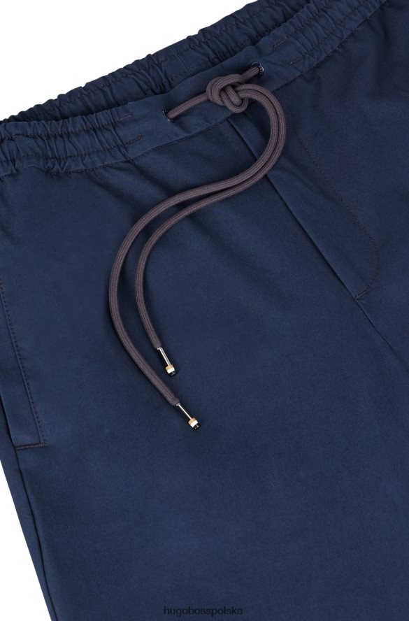 Hugo Boss Spodnie dresowe z mieszanki bawełny, z zapinanymi nogawkami, hugo ciemnoniebieskie ciemny niebieski R0X0H63401
