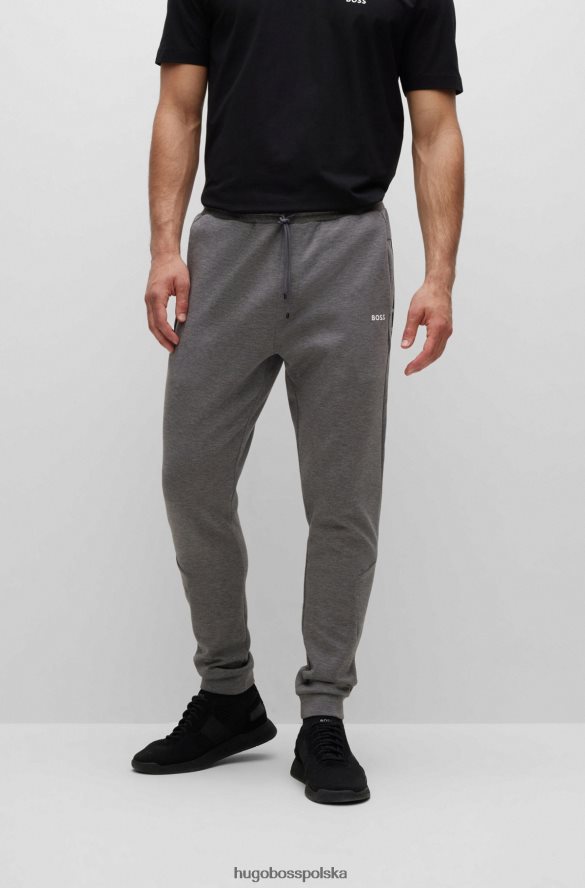 Hugo Boss Spodnie dresowe z mieszanki bawełny ze wstawkami z taśmy z logo hugo szare szary R0X0H61285
