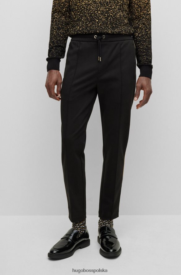 Hugo Boss Spodnie dresowe z mieszanki bawełny ze złotą lamówką w kolorze czarnym hugo czarny R0X0H63211