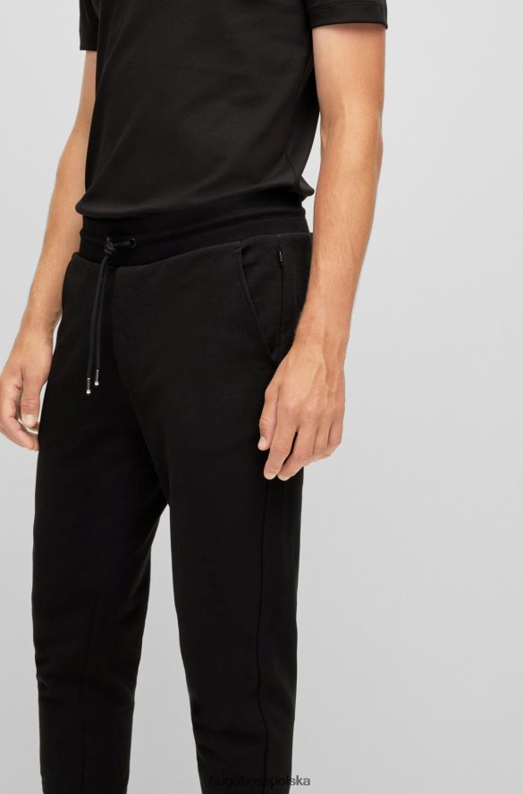 Hugo Boss Spodnie dresowe z organicznej bawełny z gumowanym nadrukiem logo, czarne hugo czarny R0X0H63031