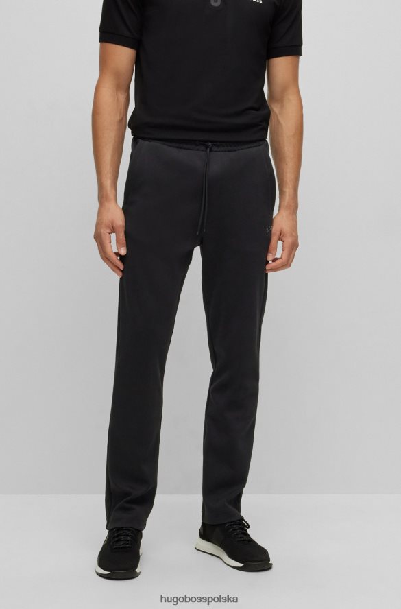 Hugo Boss Spodnie dresowe z różnych materiałów z zakrzywionym logo Hugo w kolorze czarnym czarny R0X0H61610