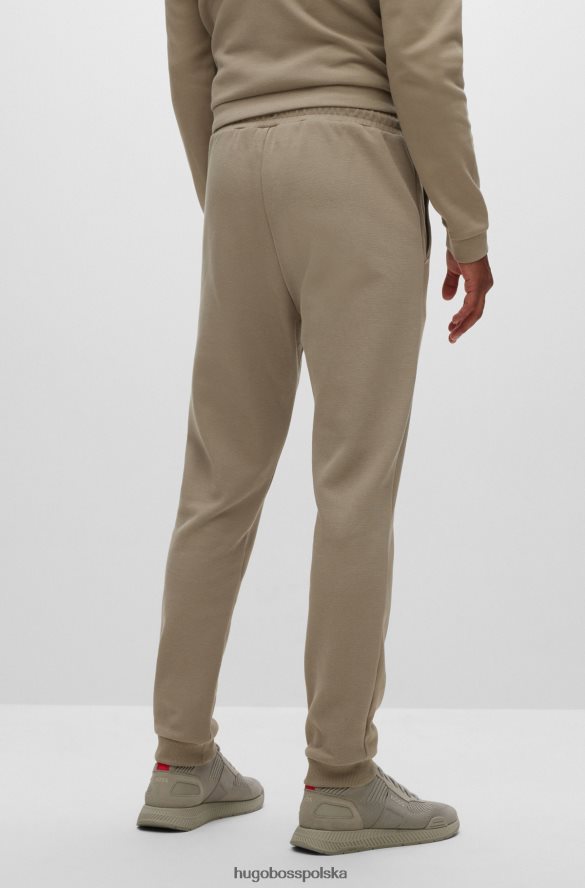 Hugo Boss bawełniane spodnie dresowe z zakrzywionym logo hugo w kolorze beżowym beżowy R0X0H62534