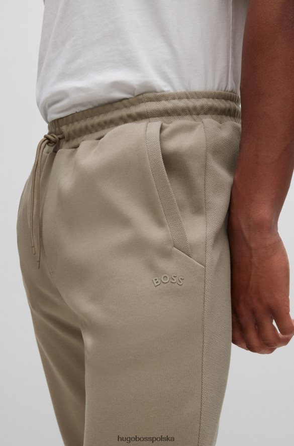 Hugo Boss bawełniane spodnie dresowe z zakrzywionym logo hugo w kolorze beżowym beżowy R0X0H62534