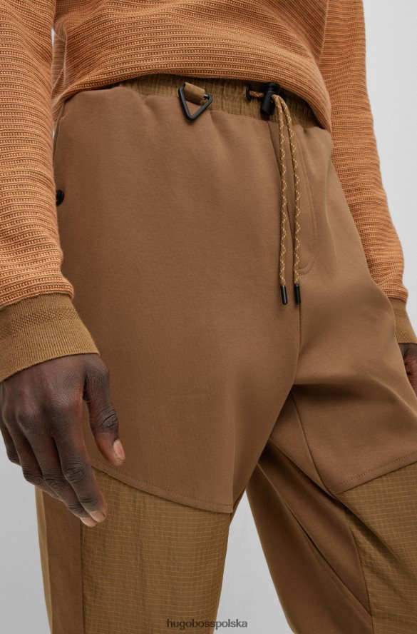 Hugo Boss brązowe spodnie dresowe z mankietami i tonalnymi wstawkami hugo brązowy R0X0H63828