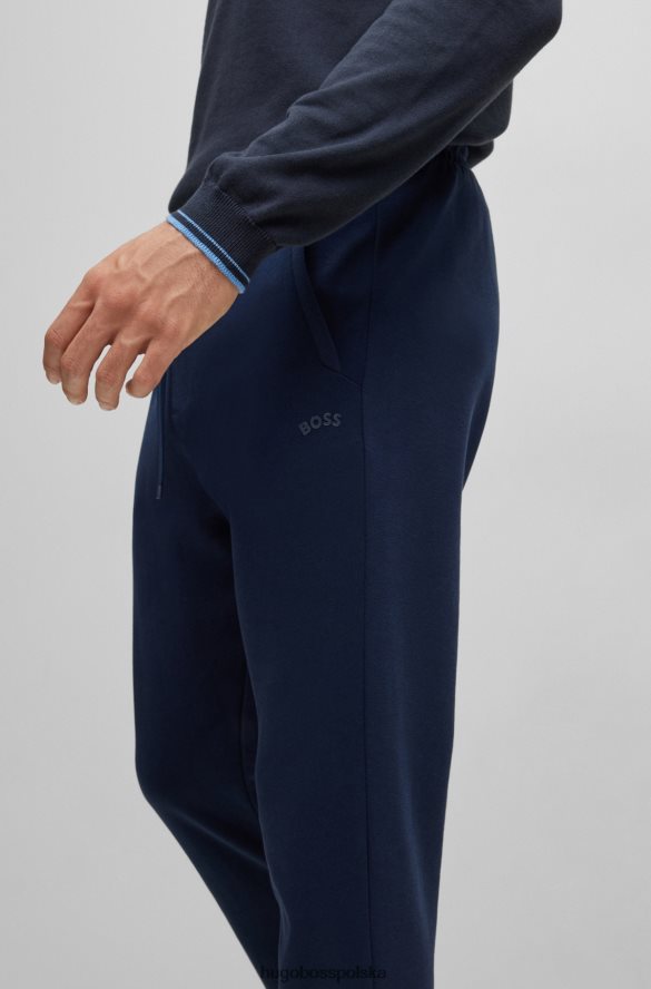 Hugo Boss ciemnoniebieskie spodnie dresowe hugo z mieszanych materiałów z zakrzywionym logo ciemny niebieski R0X0H61611