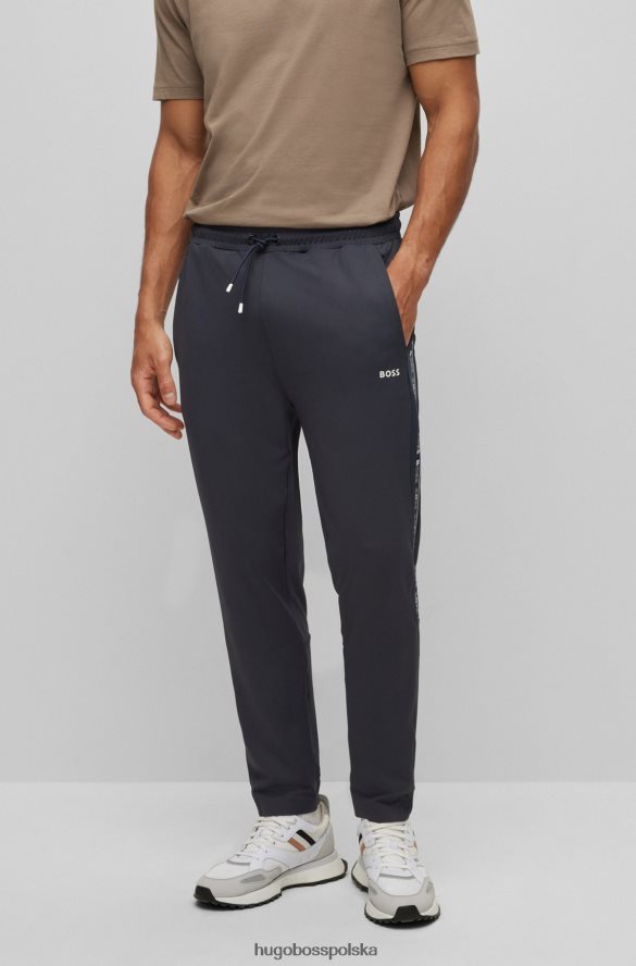 Hugo Boss ciemnoniebieskie spodnie dresowe o regularnym kroju ze wstawkami z logo hugo ciemny niebieski R0X0H62432