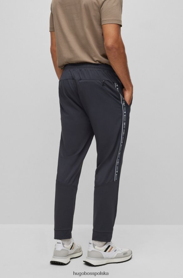 Hugo Boss ciemnoniebieskie spodnie dresowe o regularnym kroju ze wstawkami z logo hugo ciemny niebieski R0X0H62432