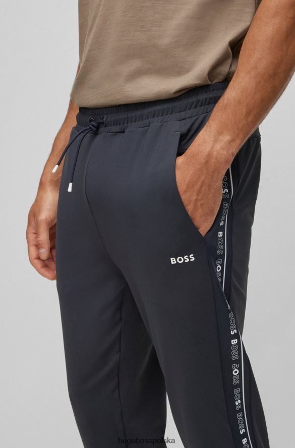 Hugo Boss ciemnoniebieskie spodnie dresowe o regularnym kroju ze wstawkami z logo hugo ciemny niebieski R0X0H62432