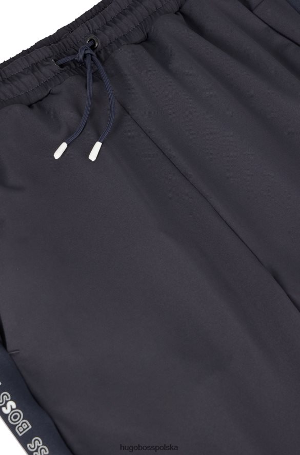 Hugo Boss ciemnoniebieskie spodnie dresowe o regularnym kroju ze wstawkami z logo hugo ciemny niebieski R0X0H62432
