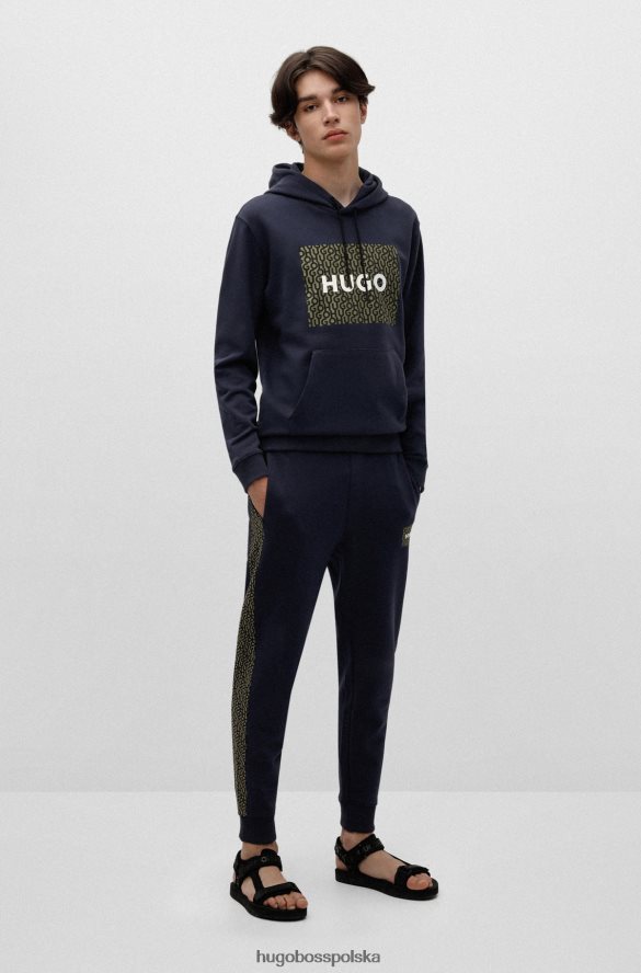 Hugo Boss ciemnoniebieskie spodnie dresowe z bawełny frotte z naszywką z logo i wstawkami hugo ciemny niebieski R0X0H62571