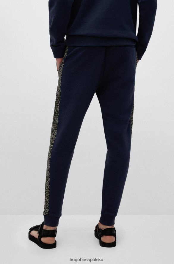 Hugo Boss ciemnoniebieskie spodnie dresowe z bawełny frotte z naszywką z logo i wstawkami hugo ciemny niebieski R0X0H62571