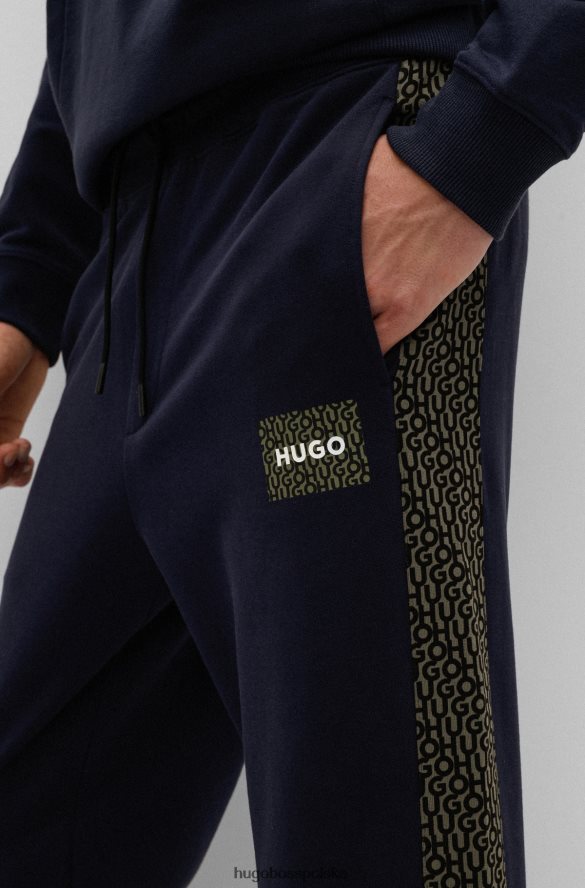 Hugo Boss ciemnoniebieskie spodnie dresowe z bawełny frotte z naszywką z logo i wstawkami hugo ciemny niebieski R0X0H62571