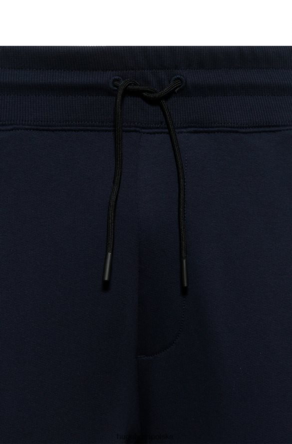 Hugo Boss ciemnoniebieskie spodnie dresowe z bawełny frotte z naszywką z logo i wstawkami hugo ciemny niebieski R0X0H62571