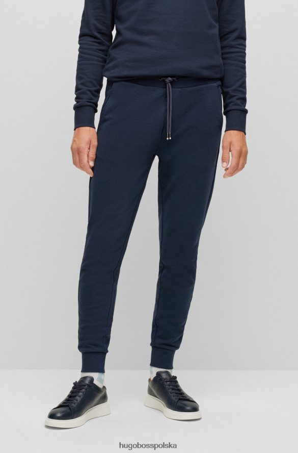 Hugo Boss ciemnoniebieskie spodnie dresowe z bawełny organicznej z gumowanym nadrukiem logo hugo ciemny niebieski R0X0H63032