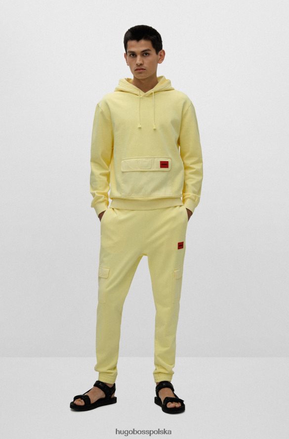 Hugo Boss jasnożółte spodnie dresowe Hugo z bawełny frotte i czerwoną metką z logo jasny zółty R0X0H64330