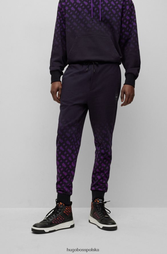 Hugo Boss x Spodnie dresowe o swobodnym kroju w kolorze khaby z mieszanki bawełny z gradientowymi monogramami czarny R0X0H64202