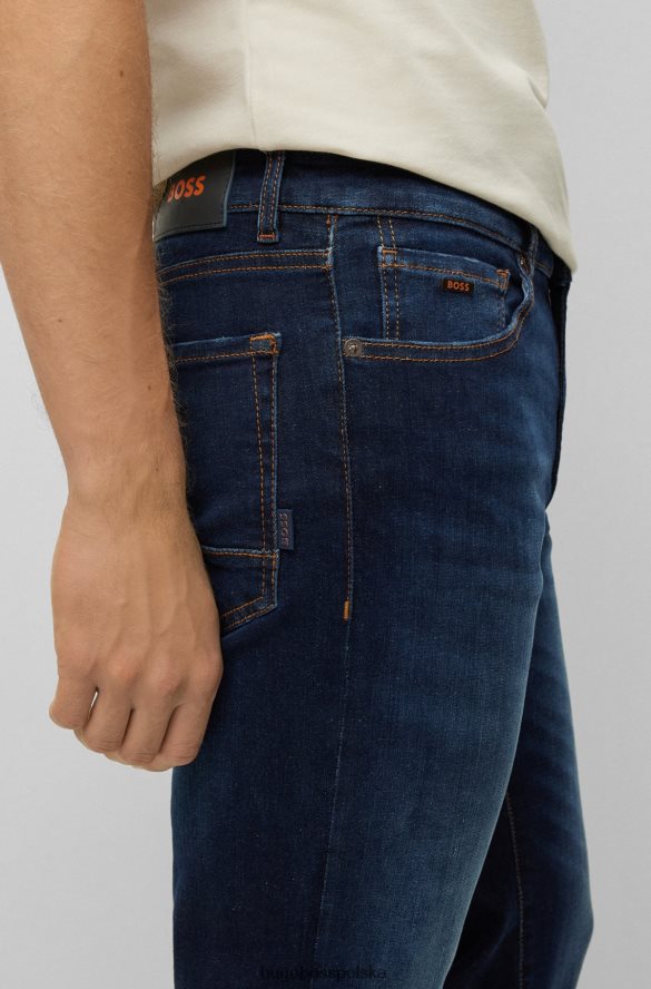 Hugo Boss ciemnoniebieskie dżinsy Hugo o dopasowanym kroju z marmurkowo-niebieskiego, wygodnego dżinsu ze stretchem ciemny niebieski R0X0H62004