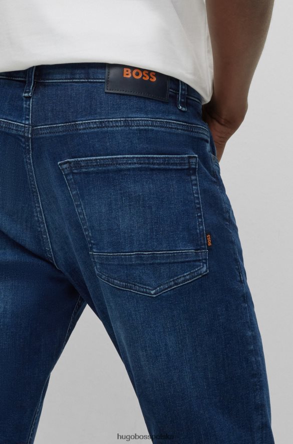 Hugo Boss ciemnoniebieskie jeansy slim fit hugo z ciemnoniebieskiego denimu o najwyższej ruchu ciemny niebieski R0X0H61839
