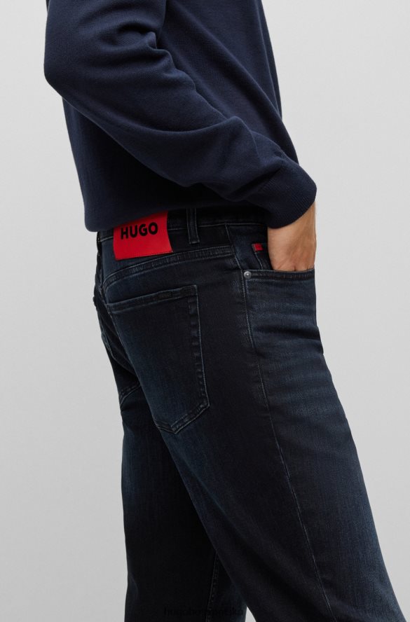 Hugo Boss ciemnoniebieskie, zwężane dżinsy hugo z niebiesko-czarnego elastycznego denimu ciemny niebieski R0X0H63611