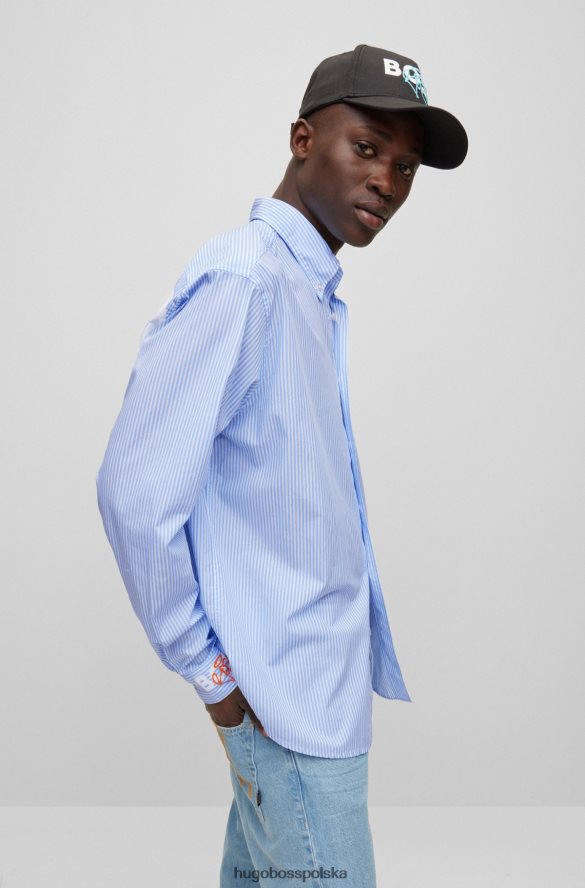 Hugo Boss jasnoniebieska koszula o swobodnym kroju z długim rękawem i grafiką graffiti hugo jasny niebieski R0X0H63578