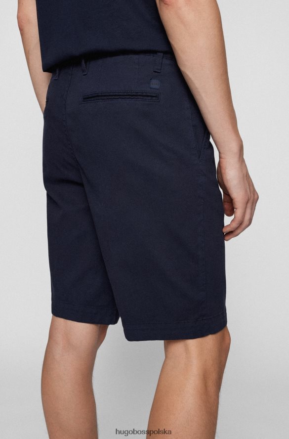 Hugo Boss Ciemnoniebieskie, zwężane szorty Hugo z tkaniny o strukturze plastra miodu z domieszką bawełny ciemny niebieski R0X0H64548
