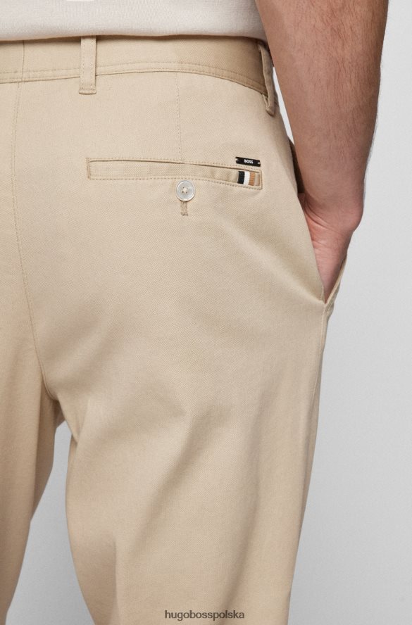 Hugo Boss Hugo jasnobeżowe, zwężane spodnie z elastycznej bawełny w mikrowzorzysty jasny beż R0X0H63617