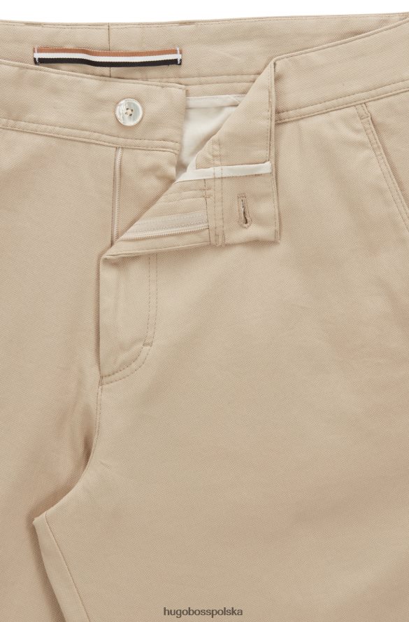 Hugo Boss Hugo jasnobeżowe, zwężane spodnie z elastycznej bawełny w mikrowzorzysty jasny beż R0X0H63617