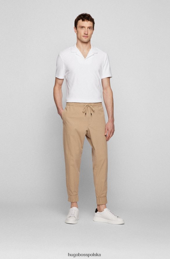 Hugo Boss Jasnobeżowe spodnie dresowe Hugo z domieszką bawełny, z zapinanymi na zamek nogawkami jasny beż R0X0H63402