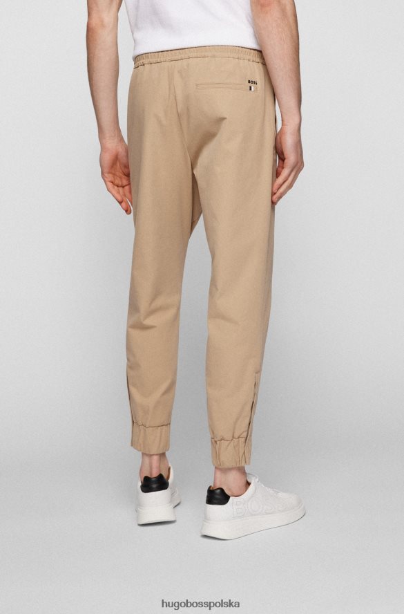 Hugo Boss Jasnobeżowe spodnie dresowe Hugo z domieszką bawełny, z zapinanymi na zamek nogawkami jasny beż R0X0H63402