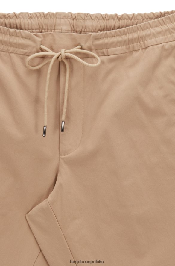 Hugo Boss Jasnobeżowe spodnie dresowe Hugo z domieszką bawełny, z zapinanymi na zamek nogawkami jasny beż R0X0H63402