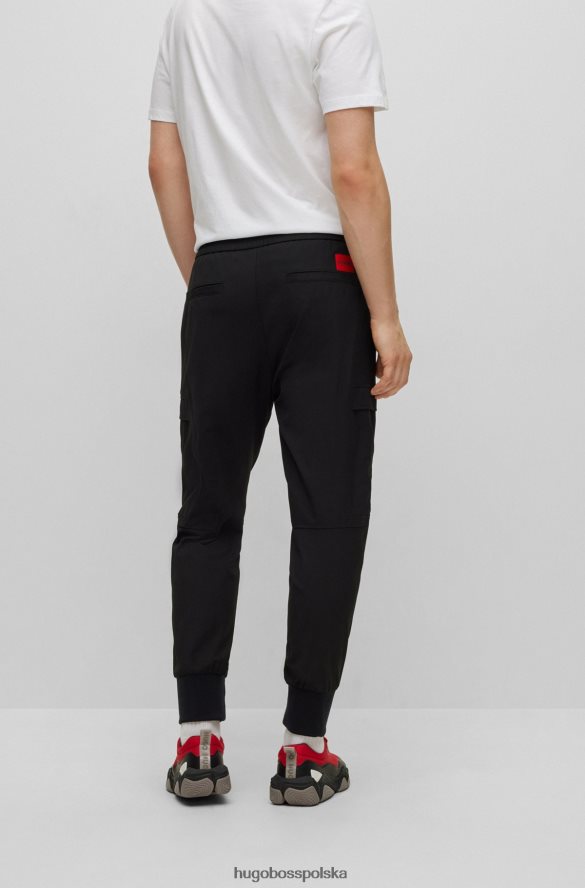 Hugo Boss Spodnie o dopasowanym kroju z mankietami, z elastycznego diagonalu hugo w kolorze czarnym czarny R0X0H63294