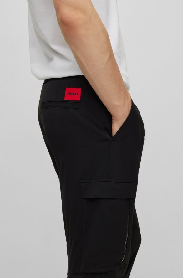 Hugo Boss Spodnie o dopasowanym kroju z mankietami, z elastycznego diagonalu hugo w kolorze czarnym czarny R0X0H63294