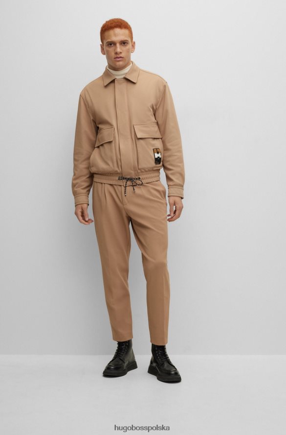 Hugo Boss Spodnie x FC Bayern o swobodnym kroju ze sznurkiem w charakterystyczne paski beżowy R0X0H64203