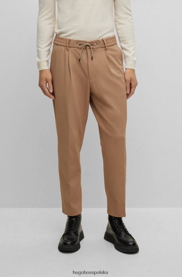 Hugo Boss Spodnie x FC Bayern o swobodnym kroju ze sznurkiem w charakterystyczne paski beżowy R0X0H64203