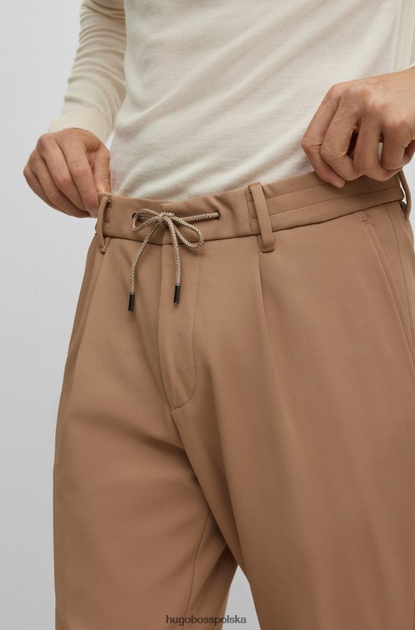 Hugo Boss Spodnie x FC Bayern o swobodnym kroju ze sznurkiem w charakterystyczne paski beżowy R0X0H64203